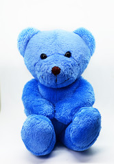 Blue teddy bear against a white background
