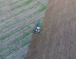 Top view of the tractor that plows the field. disking the soil. Soil cultivation after harvest