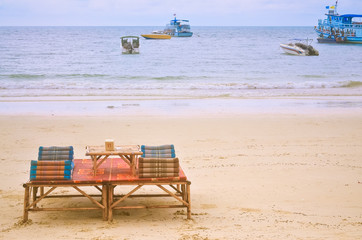 Beach chair and umbrella on sand beach