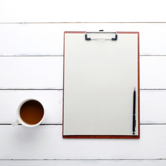 Clipboard with blank recycle paper, pen and coffee cup