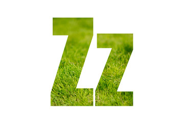 Double exposure with green grass. Letter Z. Isolated on white background