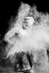 Graceful woman dancing in cloud of dust   © fyb