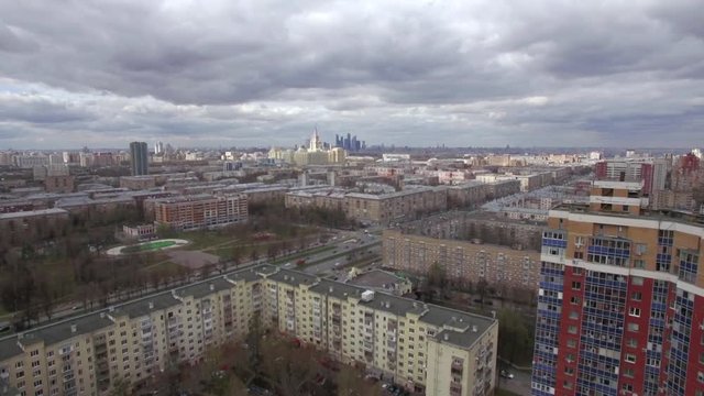Aerial view of Moscow with Leninsky Avenue. Cityscape with apartment blocks. Moscow State University and Business Centre in the distance