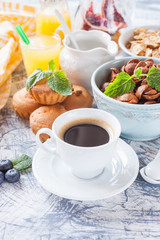 coffee, flakes and cakes on a table, selective focus