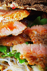 Sliced beef in a sandwich