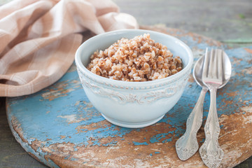 buckwheat cereal in a bowl on a table, selective focus