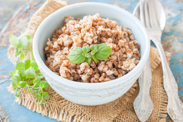 buckwheat cereal in a bowl on a table, selective focus