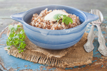 buckwheat cereal in a bowl on a table, selective focus