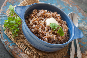 buckwheat cereal in a bowl on a table, selective focus