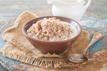 buckwheat cereal in a bowl on a table, selective focus