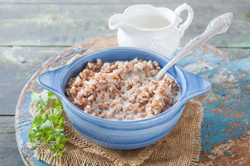 buckwheat cereal in a bowl on a table, selective focus