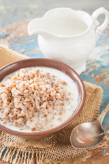 buckwheat cereal in a bowl on a table, selective focus