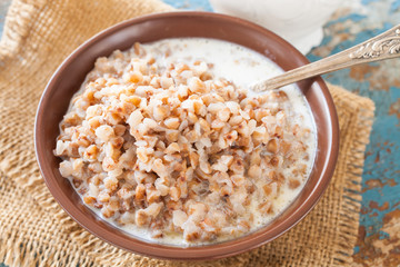 buckwheat cereal in a bowl on a table, selective focus