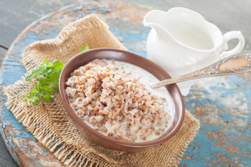 buckwheat cereal in a bowl on a table, selective focus