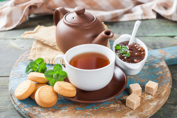 tea and jam on a table, selective focus, rustic style