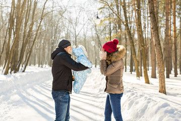 Fototapeta na wymiar happy young family spending time outdoor in winter