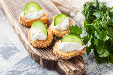 cottage cheese cheese and greens sandwiches on a board, selective focus