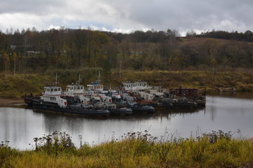 Fototapeta premium cargo ship in the river port, the industrial landscape, autumn