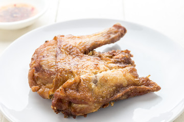 Delicious chicken on wooden table