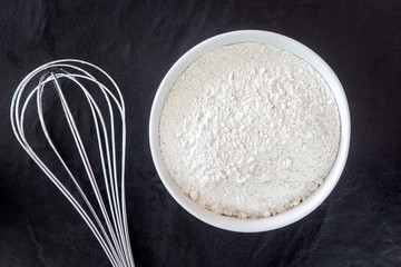 Baking background with flour on black table