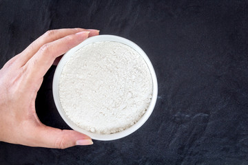 Baking background with flour on black table