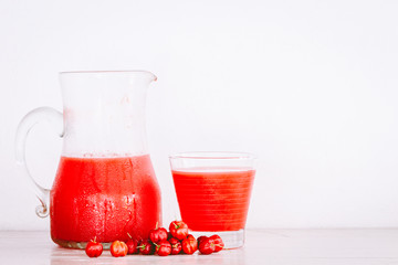 Red fruit drink on wooden table