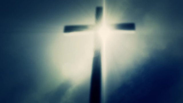 Wooden Cross on a Cloudy Misty Sky Background