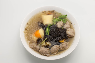 Minced pork and soy bean curd soup in white dish isolated