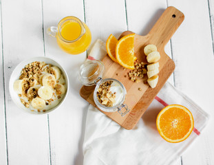breakfast on wooden table with granola top view
