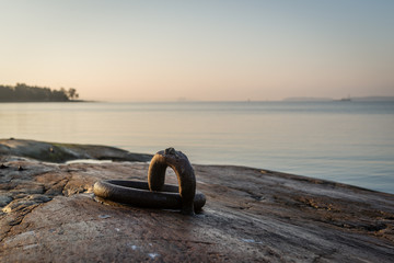 Fototapeta premium Rusty iron ring for boats.