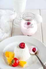 Ice cream with berries in white plate