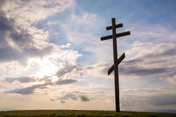 Cross on sky sunset background