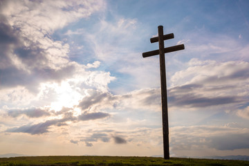 Cross on sky sunset background