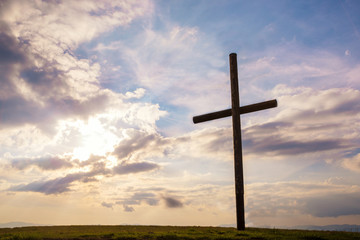 Cross on sky sunset background