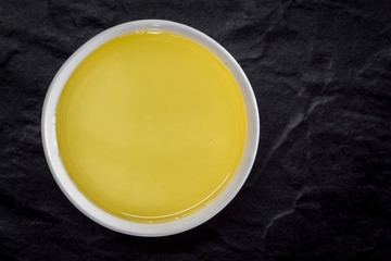 Healthy olive oil on black background