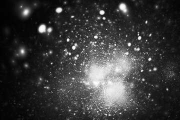 Supernova explosion. Abstract monochrome sparks on black background. Fantasy black and white fractal texture for posters, postcards or t-shirts.