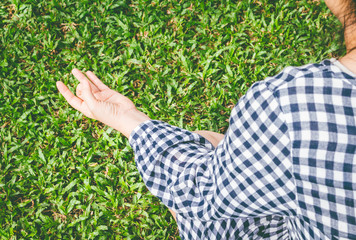 Yoga woman in park on grass field