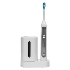 Electric ultrasonic toothbrush isolated on white background