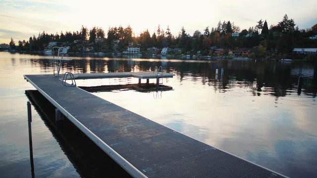 Colorful Sunset Dock on Reflective Lake
