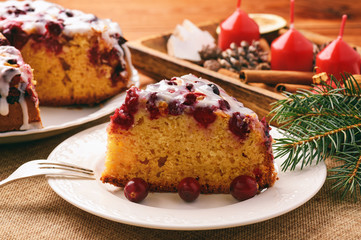 Cranberry cake with icing on festive christmas table.