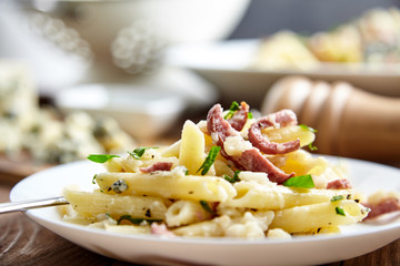 Pasta of Penne rigate, celery and smoked sausage