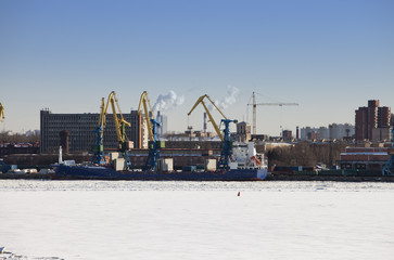 Obraz premium St. Petersburg. Seaport. Russia.View from the Gulf of Finland covered with ice