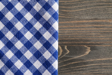 Blue checkered napkin on gray wooden table mock up
