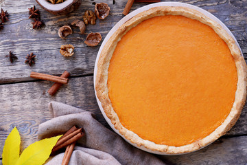 Delicious pumpkin cake on wooden table