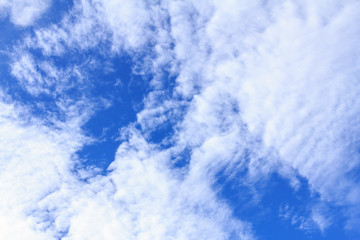 Obraz premium Blue sky background with white clouds. The vast blue sky and clouds sky on sunny day. White fluffy clouds in the blue sky.