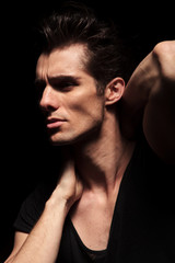 side closeup picture of a sexy fashion man posing