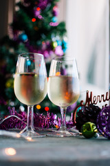 glasses of white wine with Christmas decoration