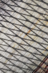 Shadow and line on wooden floor, abstract concept and pattern idea