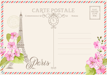 Fototapeta na wymiar Old blank postcard with post stamps and eiffel tower with spring flowers on the top. Vector illustrtion.