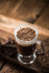 Irish coffee with grated dark chocolate